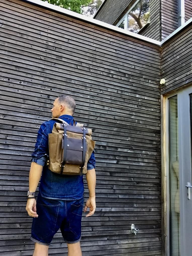 Image of  Hipster Backpack in waxed canvas with roll up top and double bottle pocket