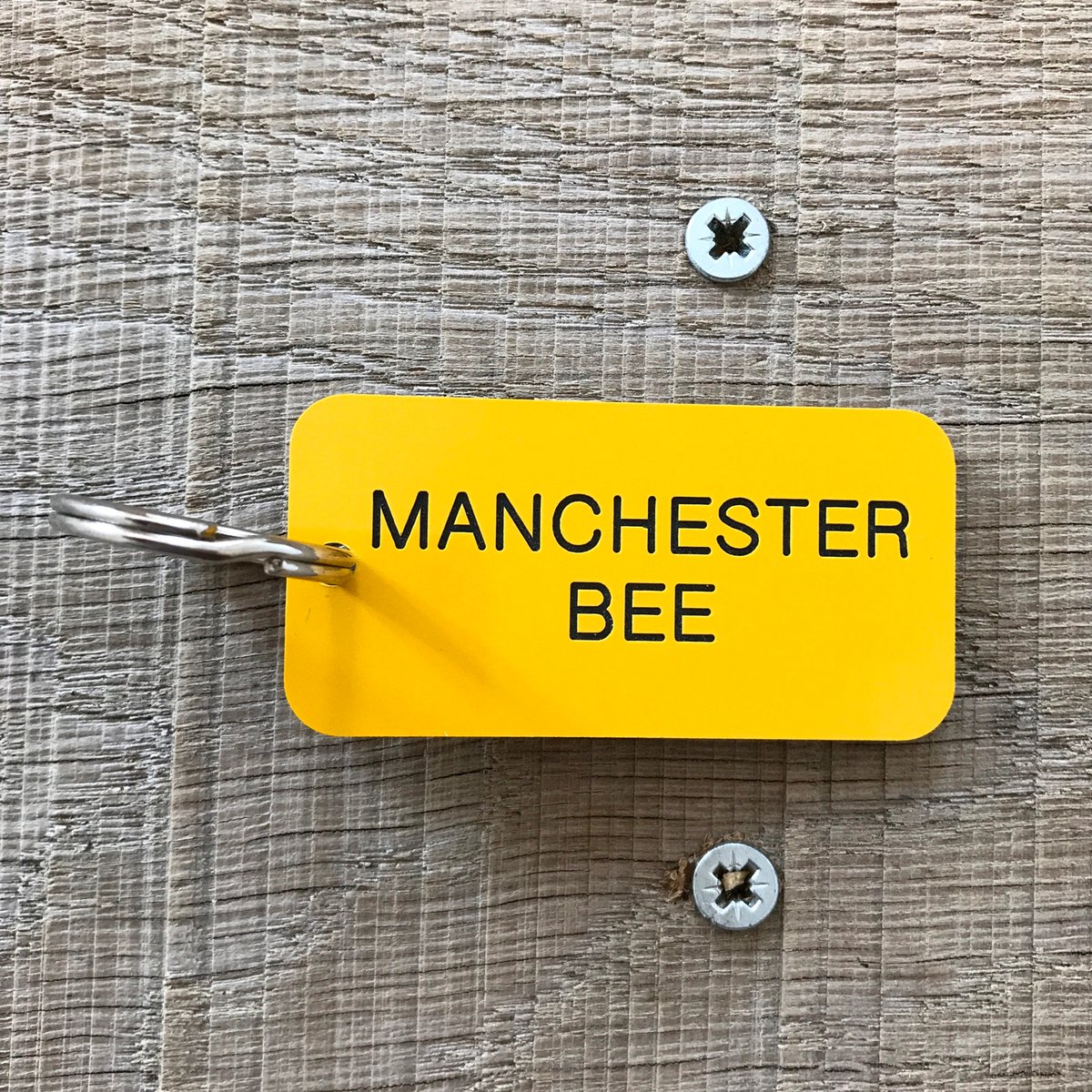 Image of Manchester Worker Bee locker keyring in Yellow + Black