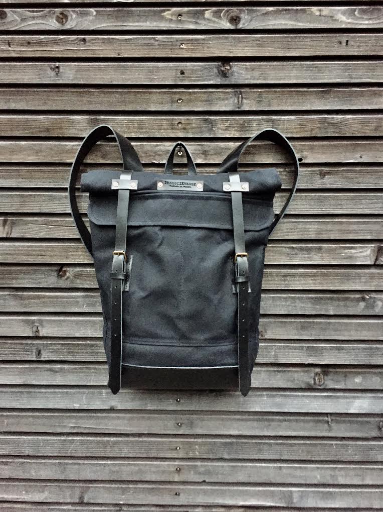 Image of Waxed canvas backpack with roll up top and leather shoulder straps COLLECTION UNISEX