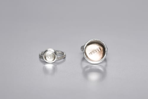 Image of "Hope of the world" silver rings with rock crystal and smoky quartz  · SPES MUNDI ·