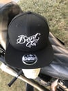 Bent Co. New Era Black w/ White script SnapBack