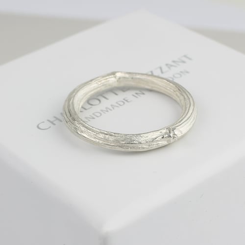 Image of  silver apple twig ring. 