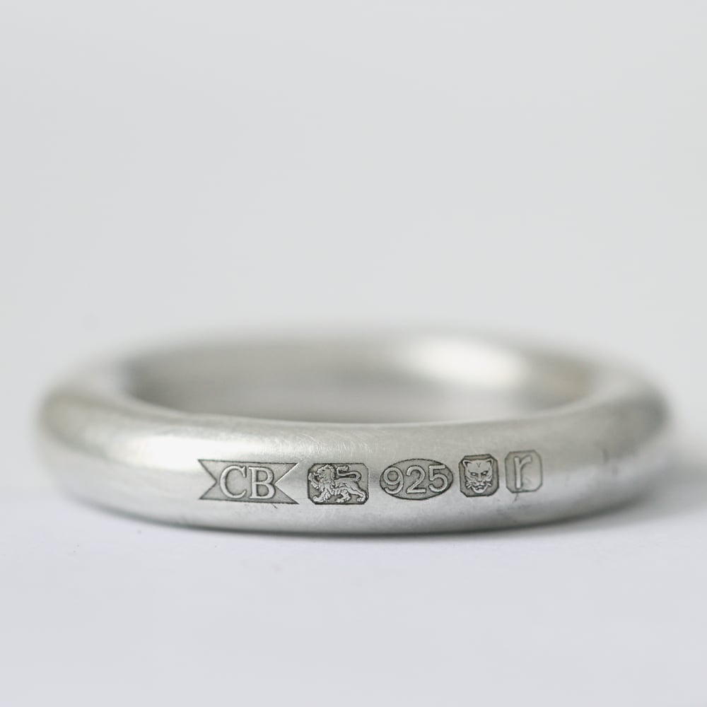 Image of handmade silver ring with feature hallmark ring 