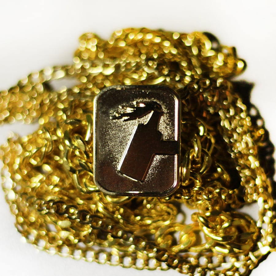Gold C logo Pin