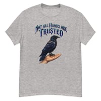 Image 4 of Trust Your Instincts Raven Unisex Graphic Tee – Gothic Raven & Hand Streetwear Design