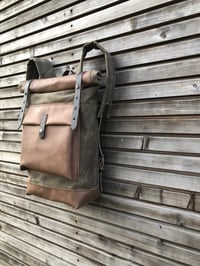 Image 2 of Waxed canvas backpack with roll up top and oiled leather bottem in dark taupe