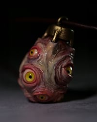 Image 7 of Egg of the King pendant, leather cord, brass hardware, all seeing glowing eyes