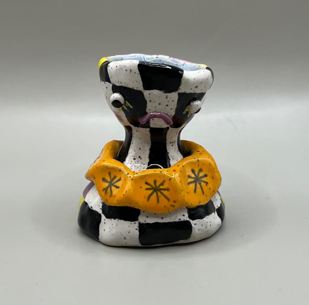Image of two faced candle holder