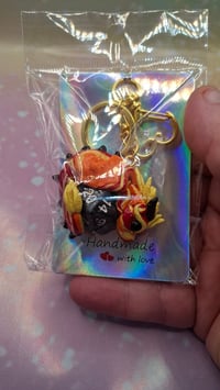 Yellow and orange dragon d20 keychain