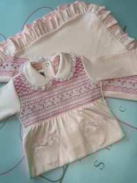 Image 2 of girls pink smocked babygrow