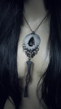 Image 1 of Relic with obsidian and long bone 