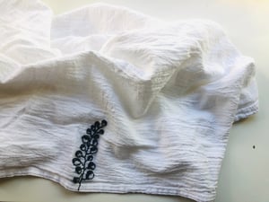 Image of botanical gris hand embroidered towel