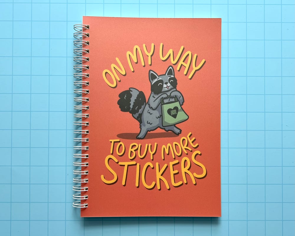 Image of Sticker collecting raccoon reusable sticker book