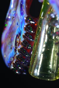 Image 3 of Opalized amber purple T-Rex skull pendant with illuminati joint tip