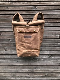 Image 1 of Waxed canvas rucksack / waterproof backpack with roll up top and double waxed bottom