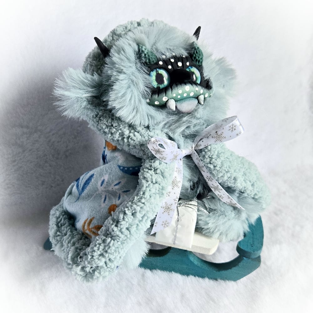 Image of Baby Krampus on Sled