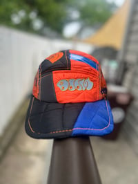 Image 1 of NF DOOM 5-Panel Puffer Blue OrangeGlow Reflect Patchwork