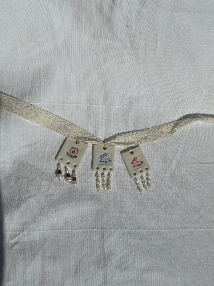 Image of porcelain and pearls pendants