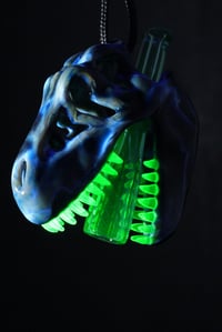 Image 1 of Fade to black T-Rex skull pendant with uv stardust tip & illuminati teeth 🦖😤