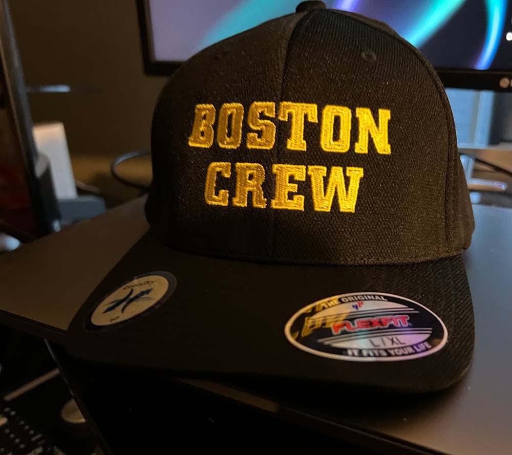 Black Flexfit hat with yellow “Boston Crew" Logo