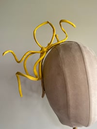 Image 1 of Yellow rouleau bow