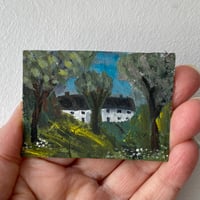 Two cottages on a blue sky day