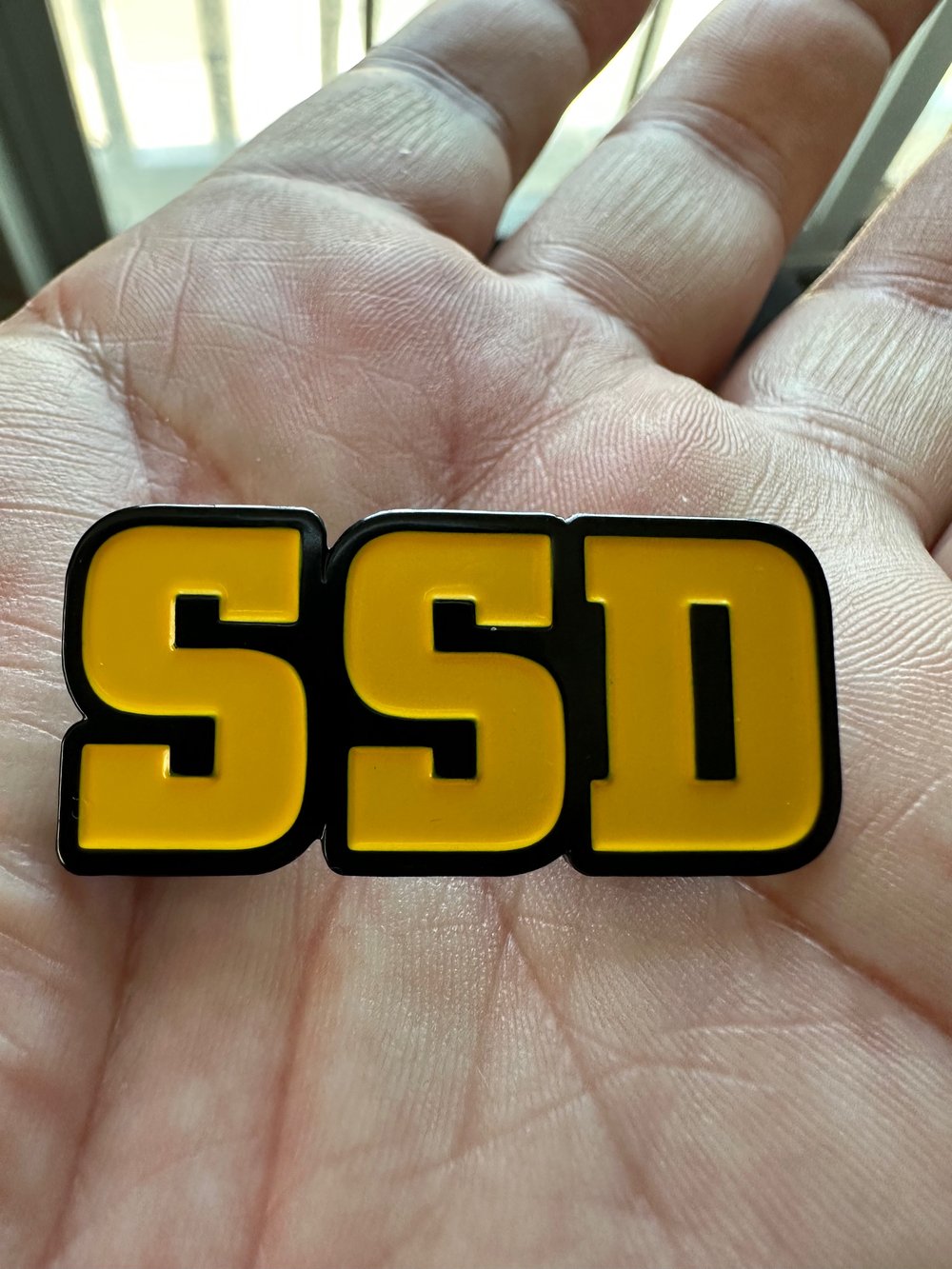 Gold SSD logo metal badge 