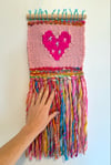 Candy yarn & a hot pink heart. Woven wall hanging.