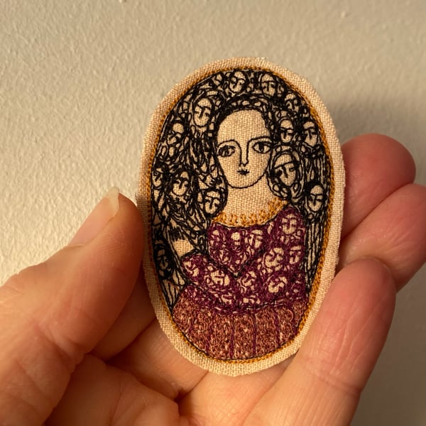 Image of a storyteller in purples - embroidery portrait brooch 