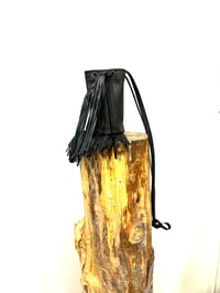 Image 1 of Tall and Slim Black Fringed Leather Crossbody Cylinder Bag