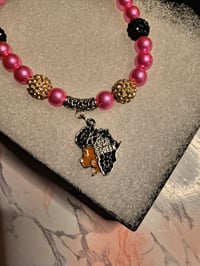Image 2 of Pink/Black Afro Queen Charm bracelet 