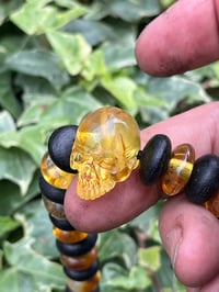 Image 1 of Bog oak and Amber skull bracelet. 