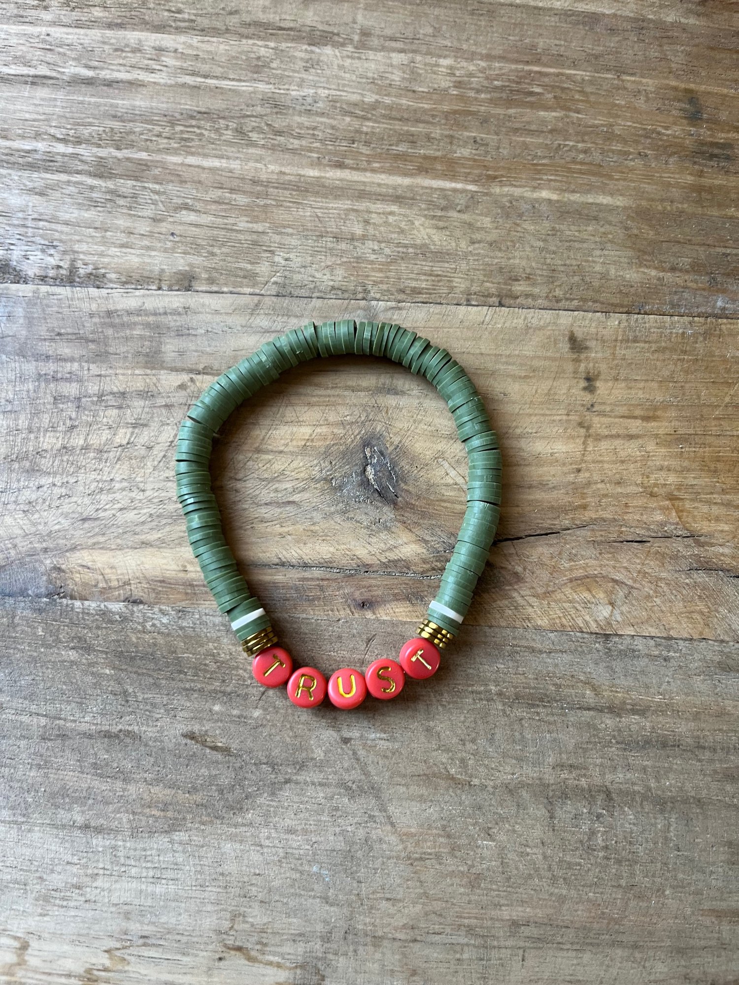 Image of Dk Green & Orange TRUST bracelet