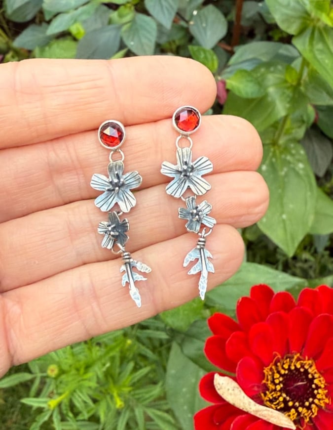 Image of Tiered Signet Marigold Flowers Leaves Garnet Stud Earrings