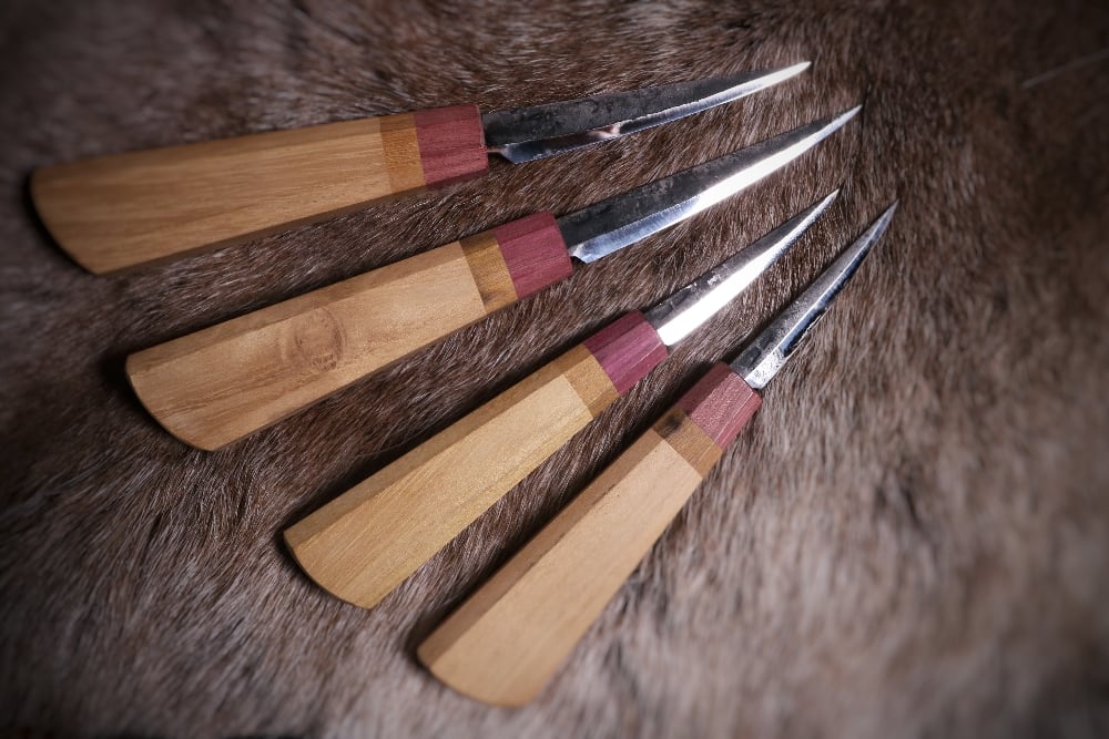 Image of 70mm and 100mm slöjd with robina, greenheart and purpleheart handle
