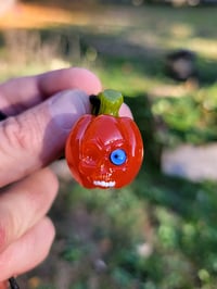 Image 2 of Blue eye small Skull Pumpkin Pendant