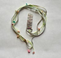 Pink barrette with yellow beads 
