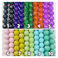 Image 1 of Painted glass bead strands.