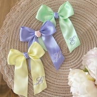 Image 1 of Pastel initial bows 