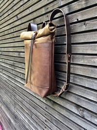 Image 2 of Leather backpack with waxed canvas roll to close top and double outside pocket