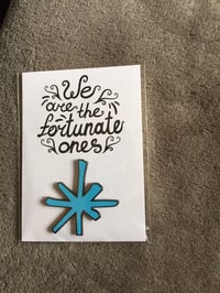 Image 1 of blue enamel asterisk pin