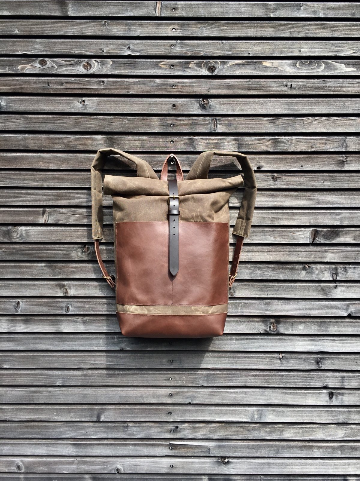 Image of Waxed canvas backpack / rucksack with leather outside pocket and bottom, unisex