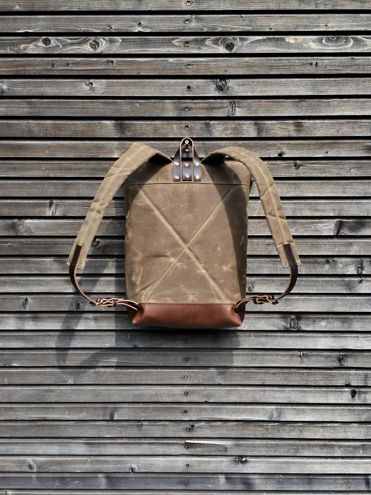 Image of Waxed canvas backpack / rucksack with leather outside pocket and bottom, unisex