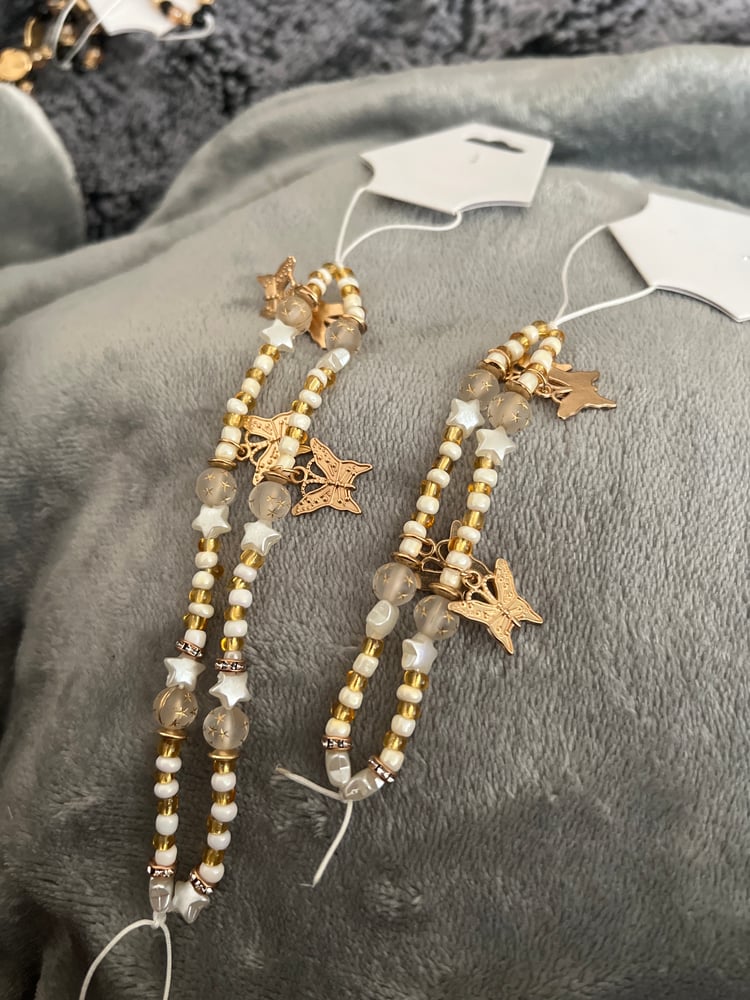 Image of golden butterfly phone charm