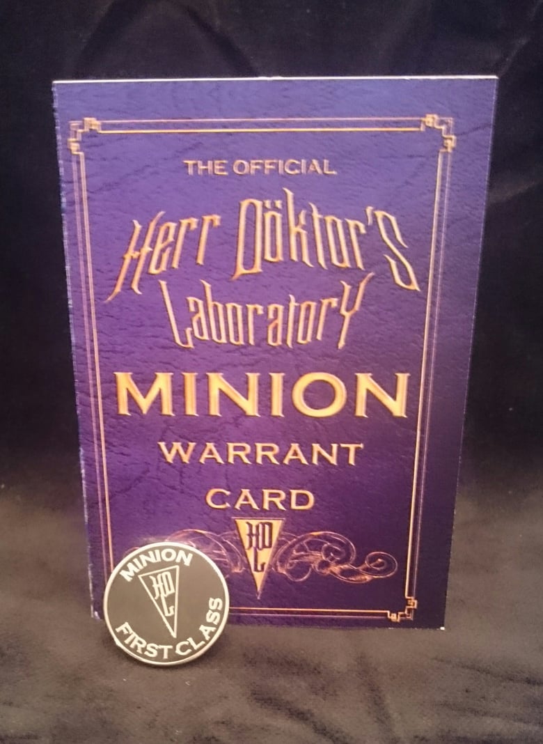 Image of Herr Döktor's OFFICIAL Minion Enamel Badge and Signed Warrant Card