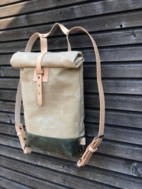 Image 4 of Small waxed canvas backpack  in natural  with rolled top and leather shoulder straps