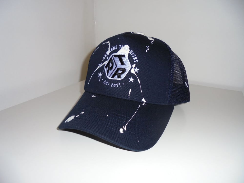 Image of Navy Blue Paint Splash Rewards Take Risks Trucker Cap