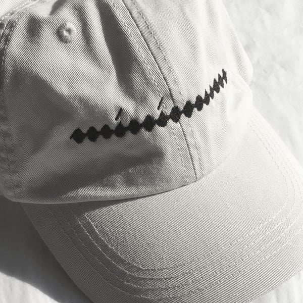 Image of Minimum Hat — black thread on stone cap