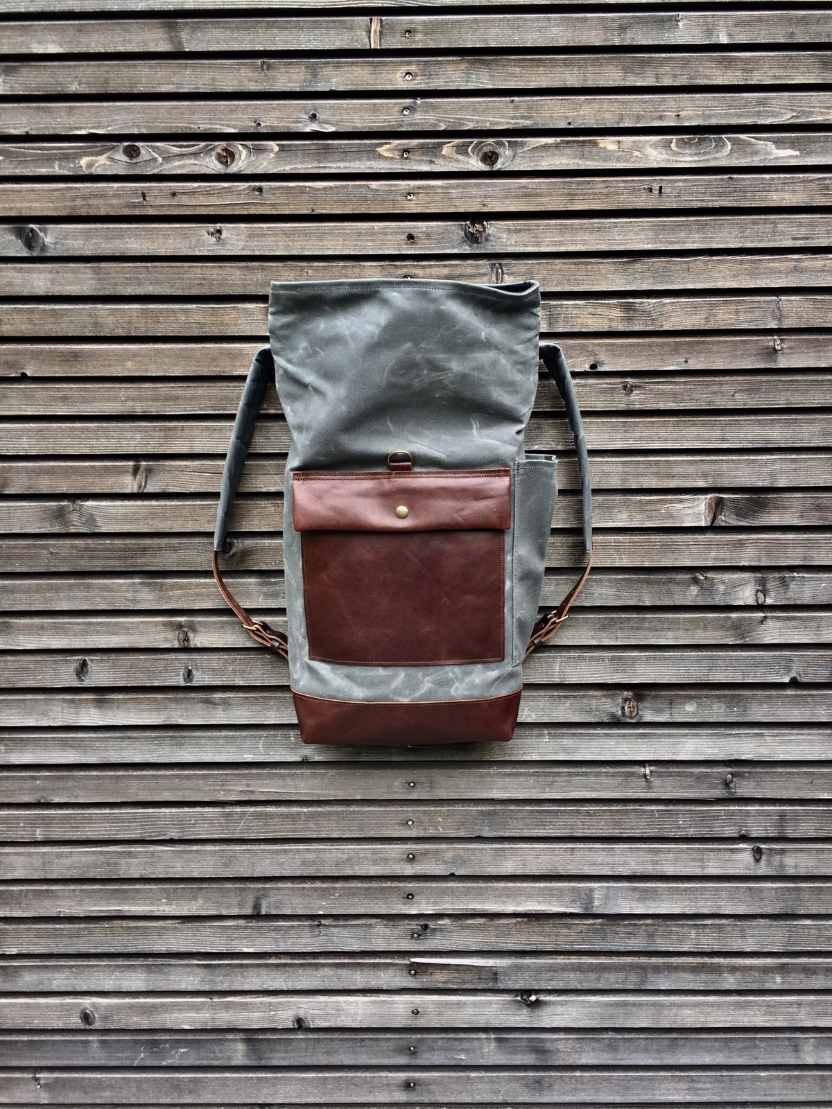Image of Waxed canvas rucksack / backpack with roll up top and leather bottom and outside pocket COLLECTION U