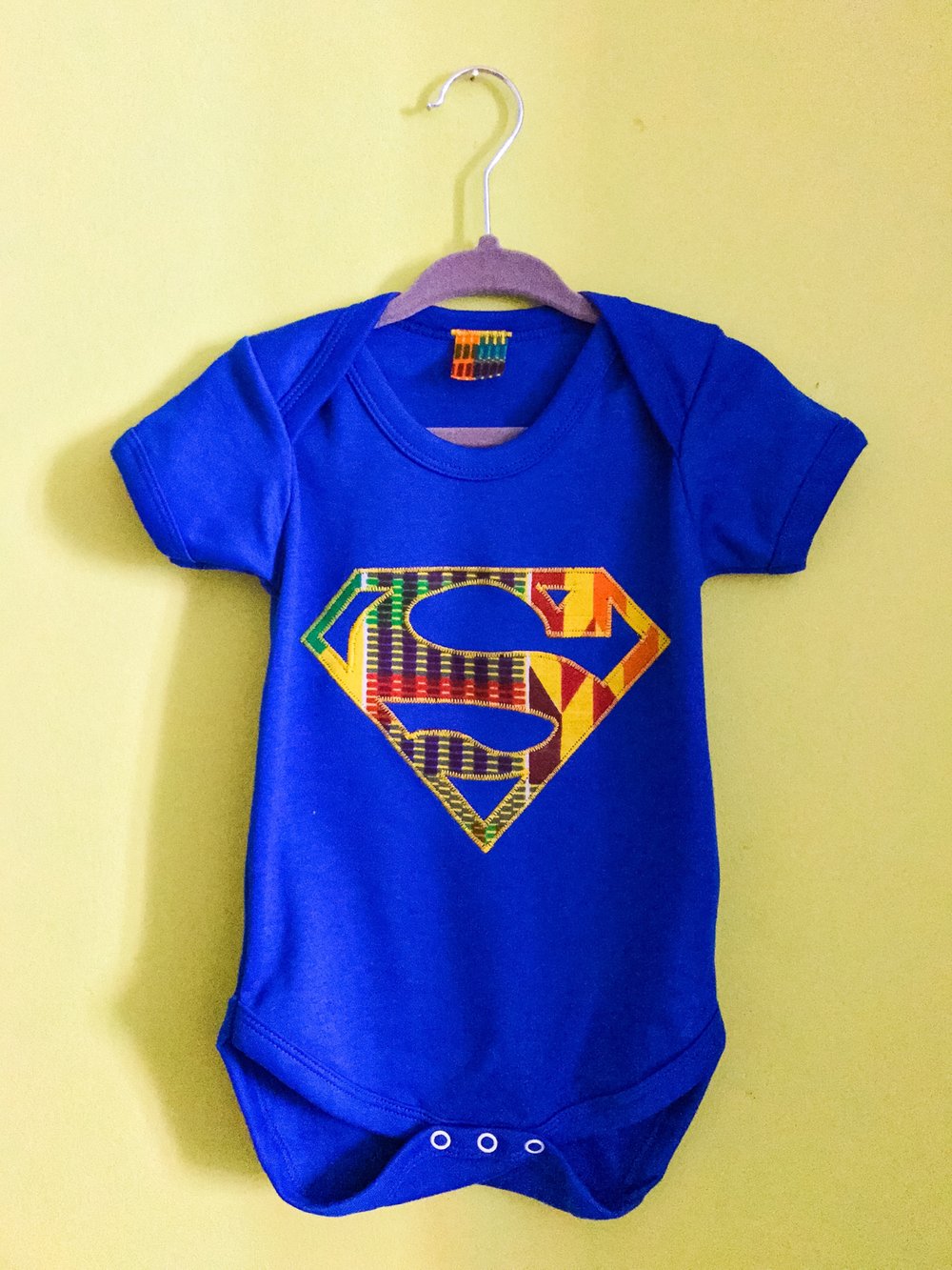 Image of Lil' Z Afro Superman Bodysuit